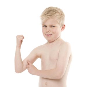little boy flexing muscles